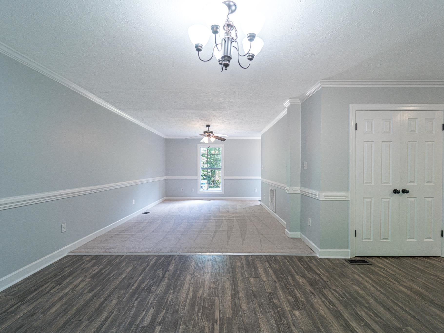 9961 Old Middlesex Road Middlesex, NC 27557 - Photo 8 of 30 wooden floor in an empty room with a window