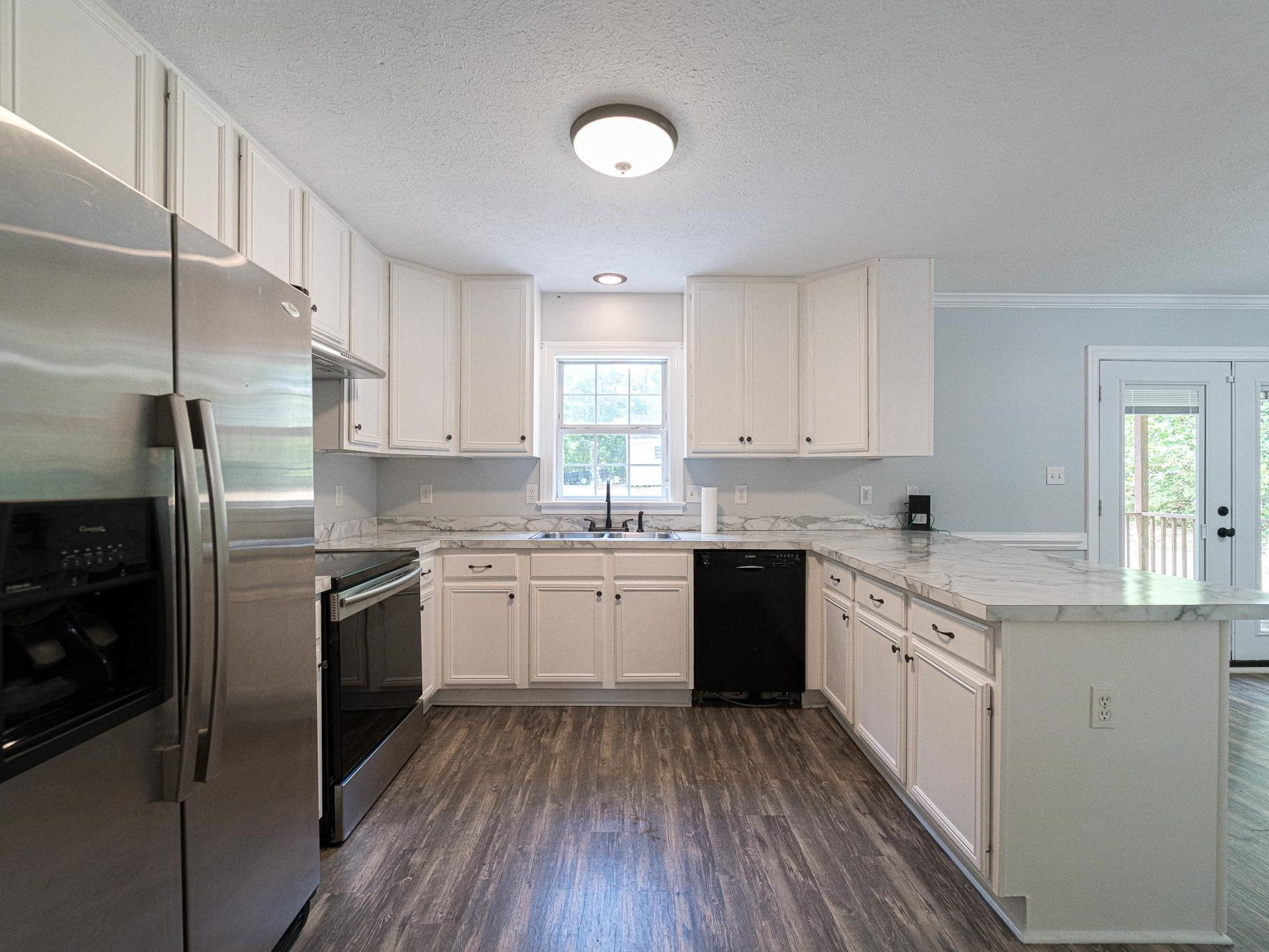 9961 Old Middlesex Road Middlesex, NC 27557 - Photo 10 of 30 a kitchen with granite countertop appliances cabinets and a sink