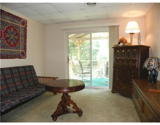 1111 Rostraver Street Monessen, PA 15062 - Photo 4 of 18 Family Room. The family room features sliding glass doors that open to a covered balcony.