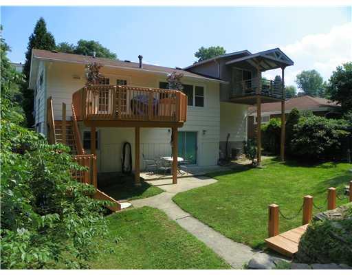 1111 Rostraver Street Monessen, PA 15062 - Photo 6 of 18 Exterior Back. This view of the rear of the home shows how the multi-level outdoor spaces complement the overall design.