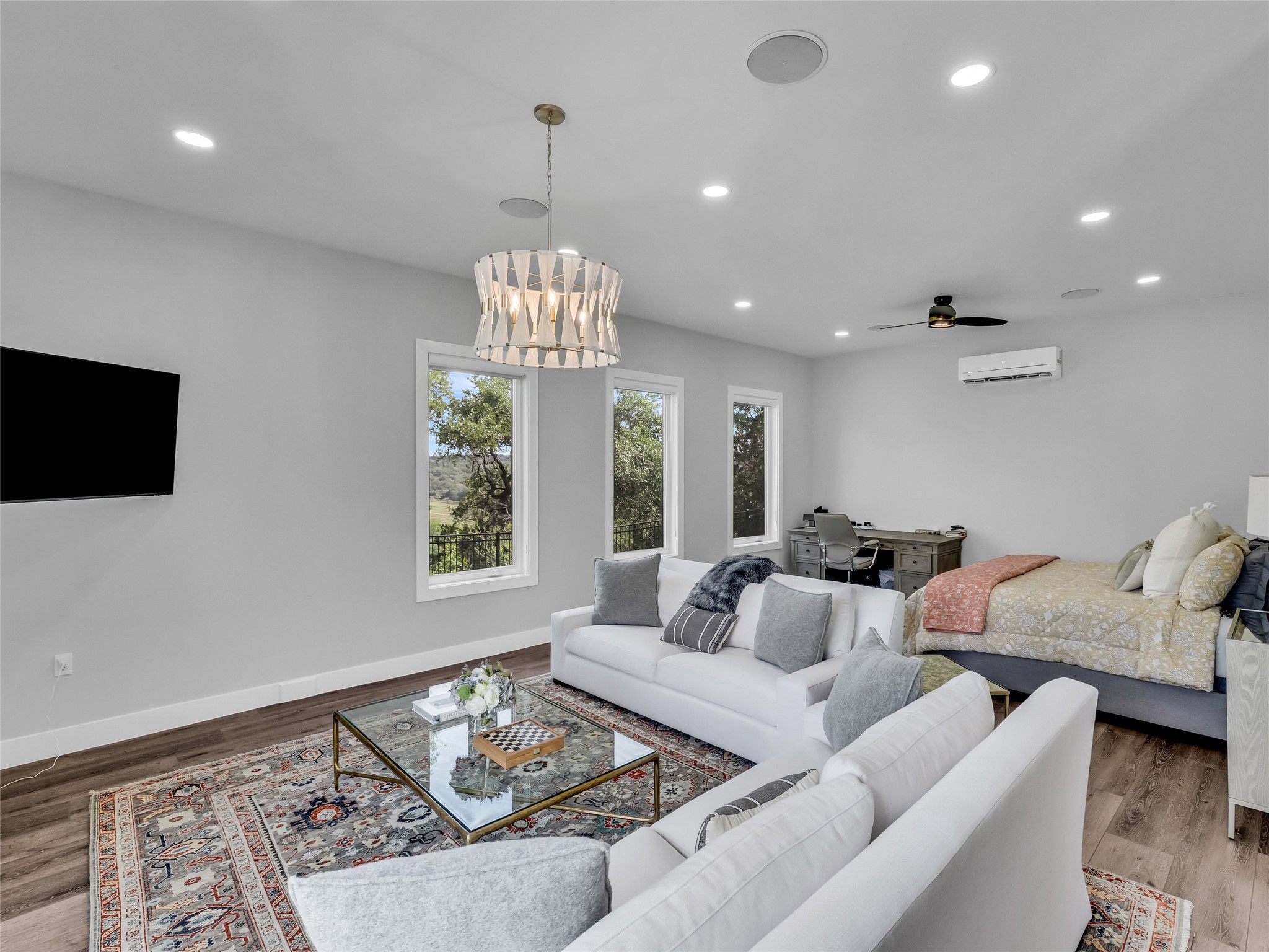 11705 Shoreview Overlook Austin, TX 78732 - Photo 26 of 34 a living room with furniture and a chandelier
