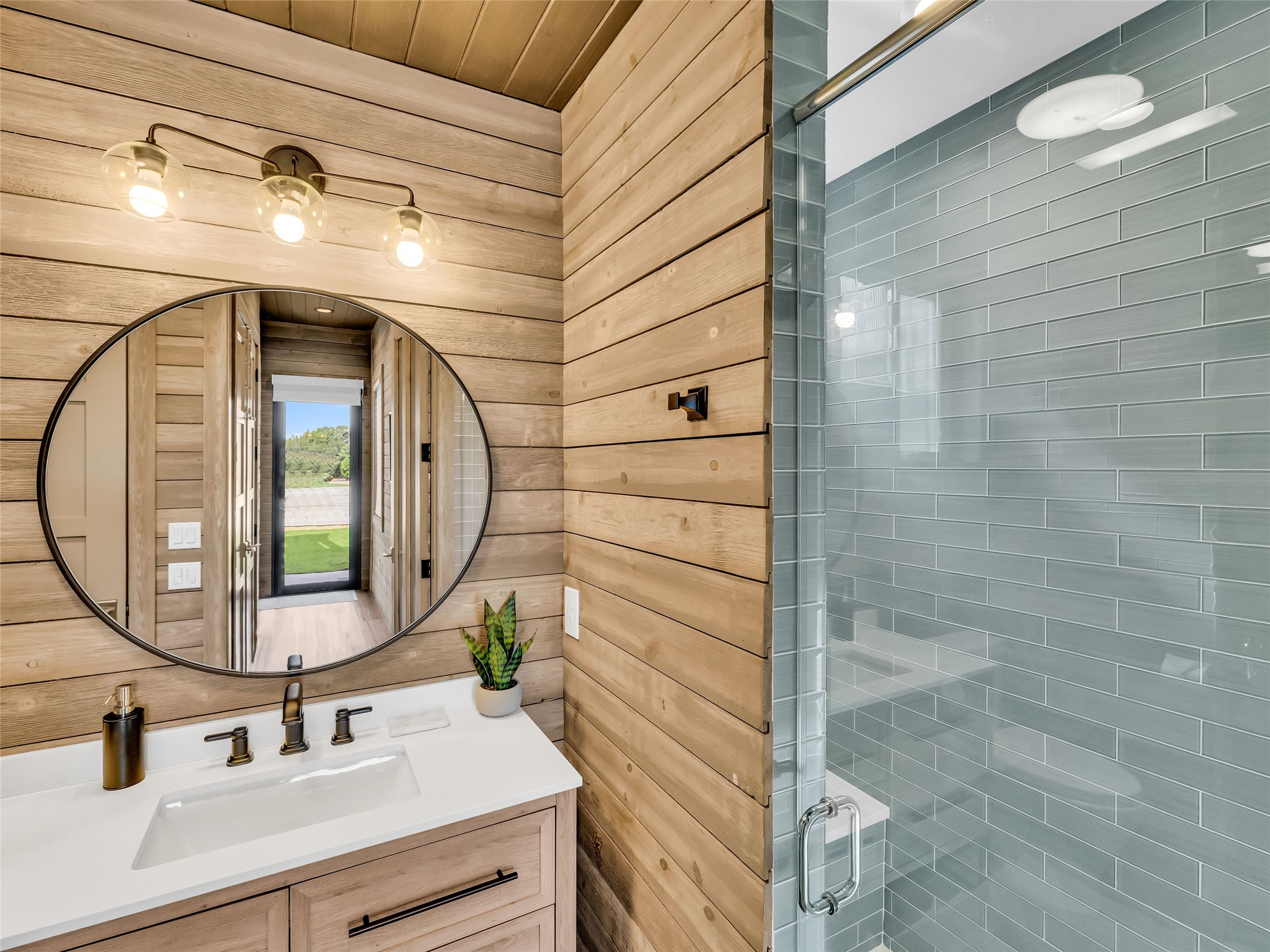 11705 Shoreview Overlook Austin, TX 78732 - Photo 27 of 34 a bathroom with a sink and a mirror