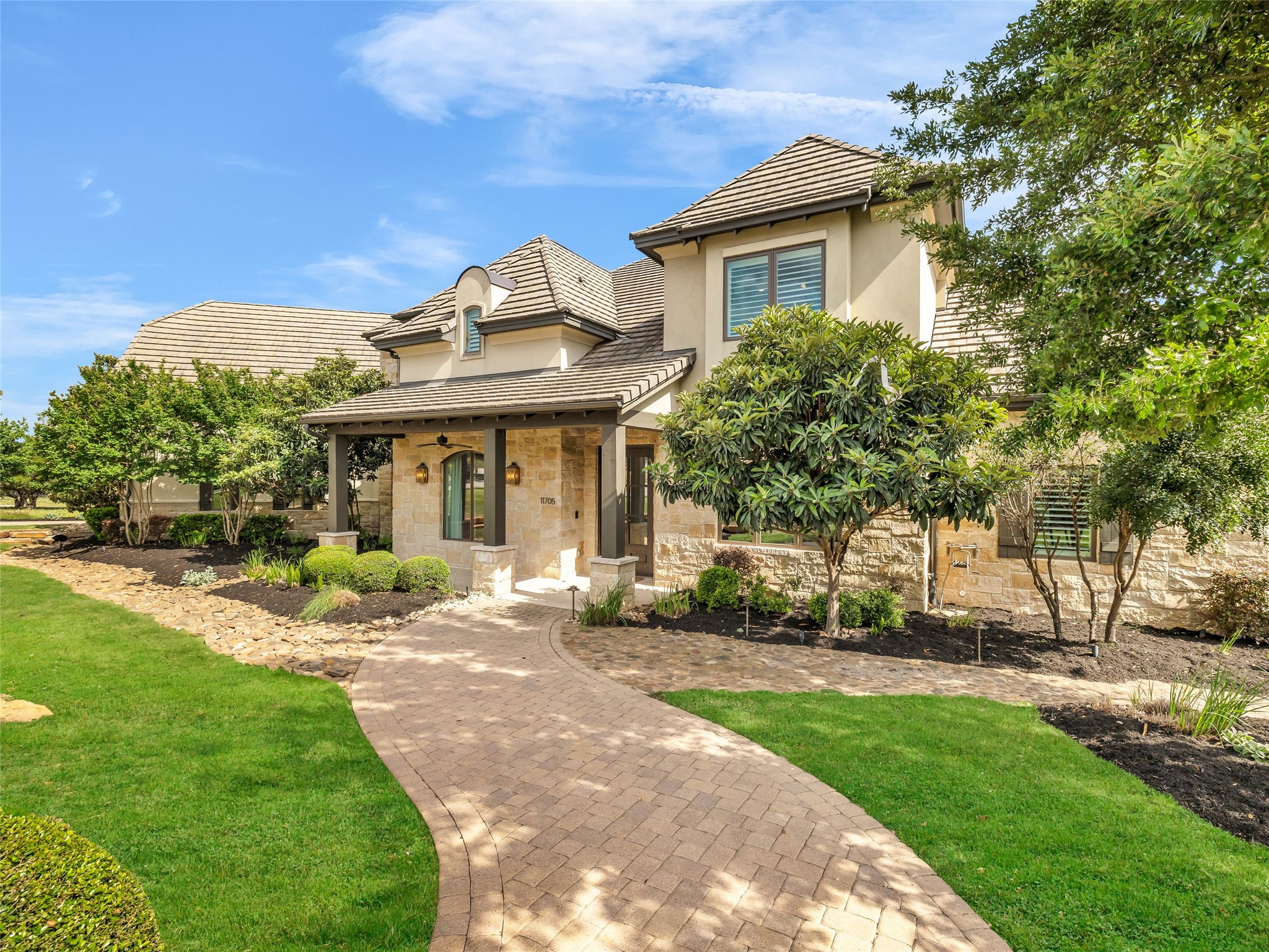 11705 Shoreview Overlook Austin, TX 78732 - Photo 8 of 34 a front view of a house with a yard