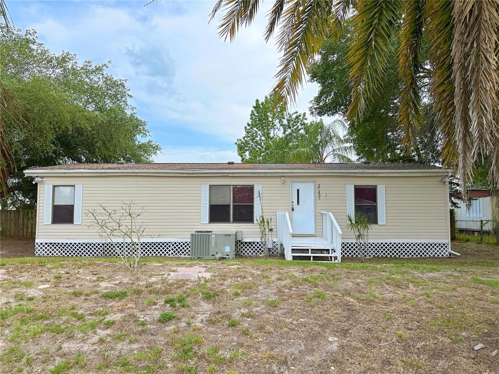 20434 Leonard Road Lutz, FL 33558 - Photo 1 of 1 front view of house with a yard and sink