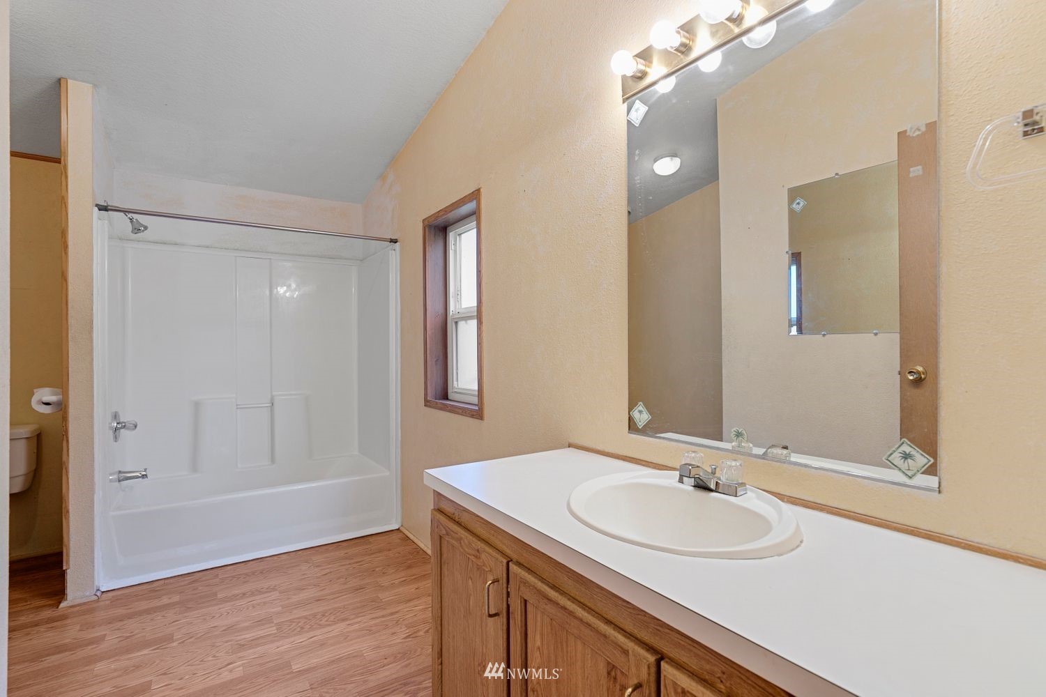 6323 190th Lane Southwest Rochester, WA 98579 - Photo 10 of 17 a bathroom with a sink double vanity and a mirror
