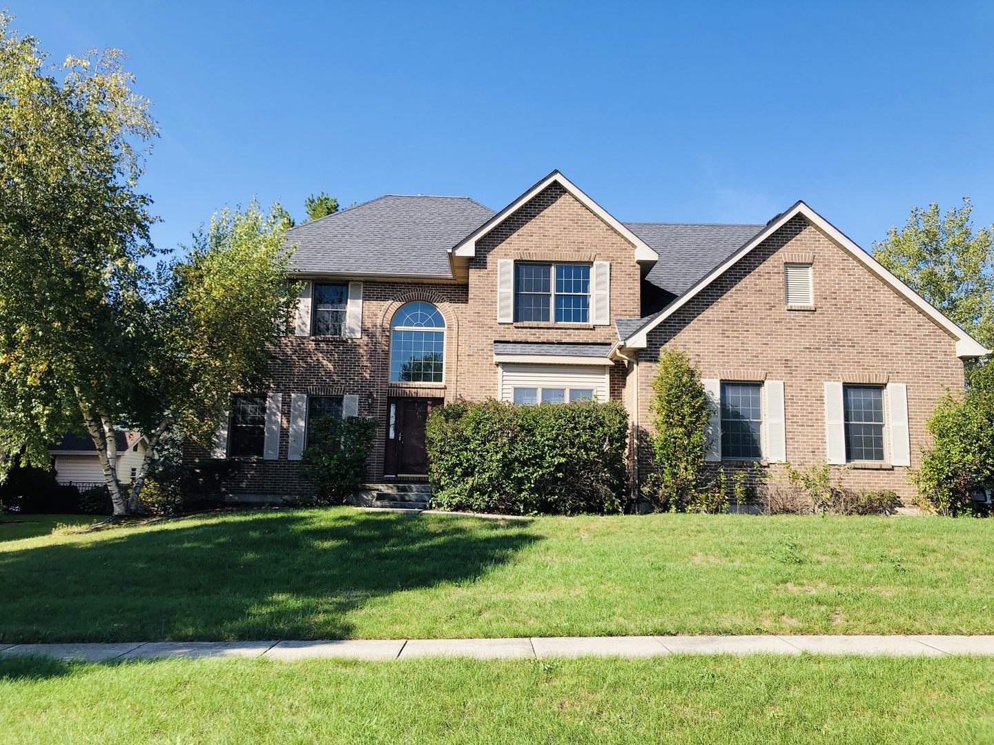 1381 Axcel Lane Sycamore, IL 60178 - Photo 1 of 39 a front view of a house with a yard