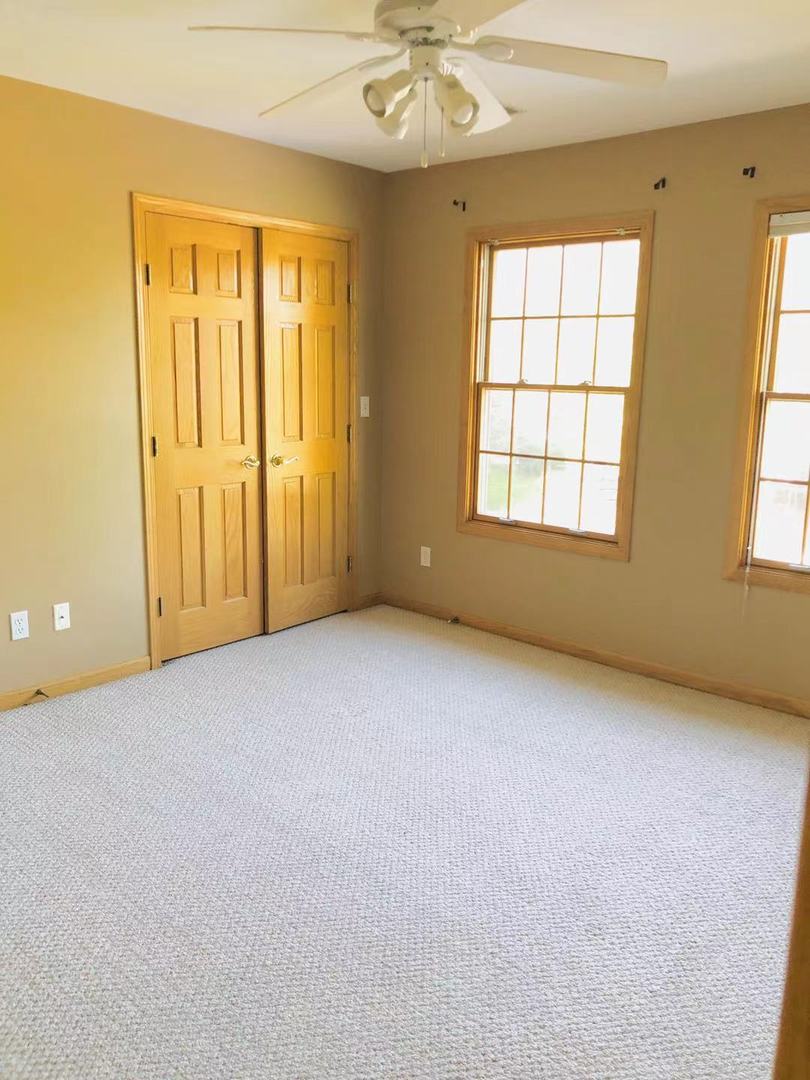 1381 Axcel Lane Sycamore, IL 60178 - Photo 17 of 39 an empty room with windows