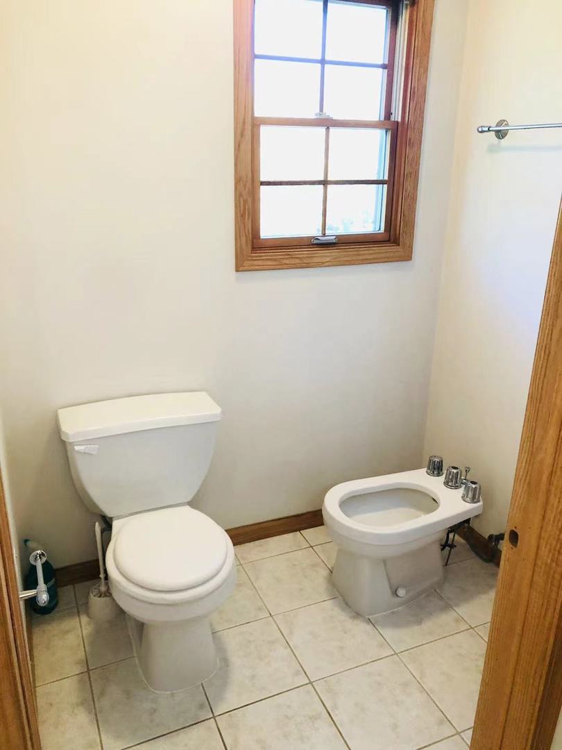 1381 Axcel Lane Sycamore, IL 60178 - Photo 24 of 39 a white toilet sitting next to a bathroom sink