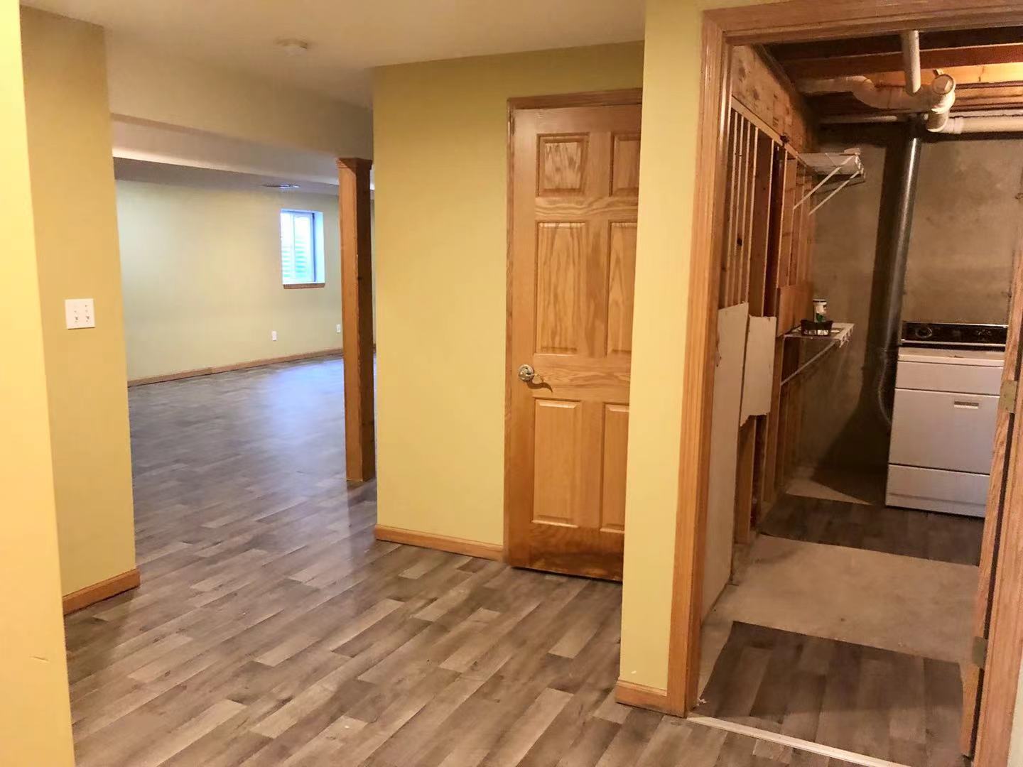 1381 Axcel Lane Sycamore, IL 60178 - Photo 26 of 39 a view of a hallway with wooden floor