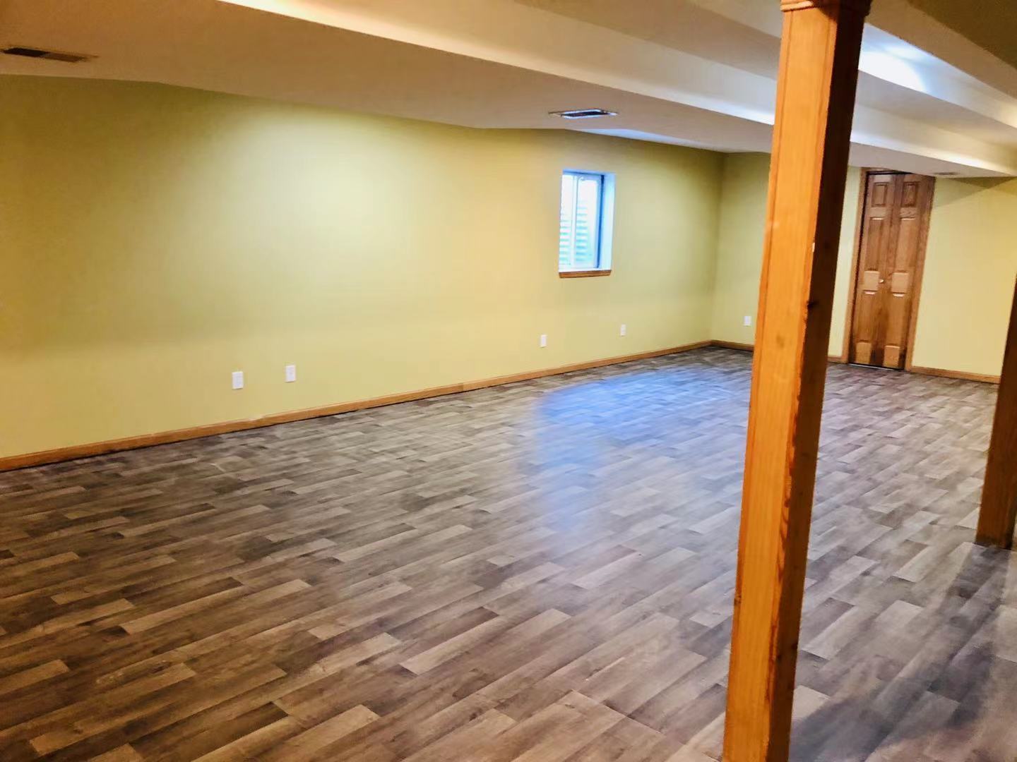 1381 Axcel Lane Sycamore, IL 60178 - Photo 27 of 39 a view of an empty room with wooden floor and a window