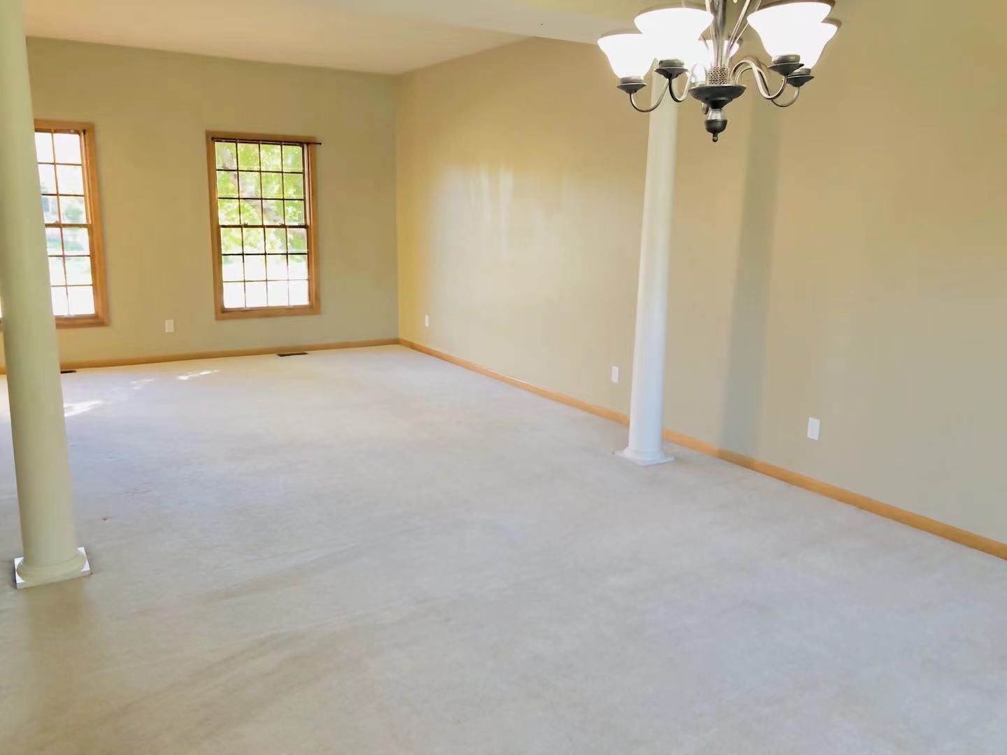 1381 Axcel Lane Sycamore, IL 60178 - Photo 9 of 39 wooden floor in an empty room with a window