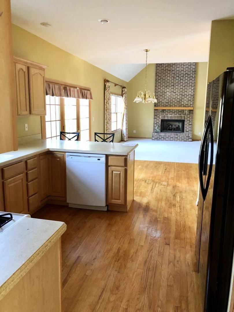 1381 Axcel Lane Sycamore, IL 60178 - Photo 10 of 39 a kitchen with stainless steel appliances granite countertop a stove a sink dishwasher and a refrigerator