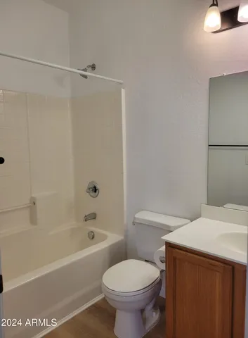 a bathroom with a sink a toilet and a bathtub