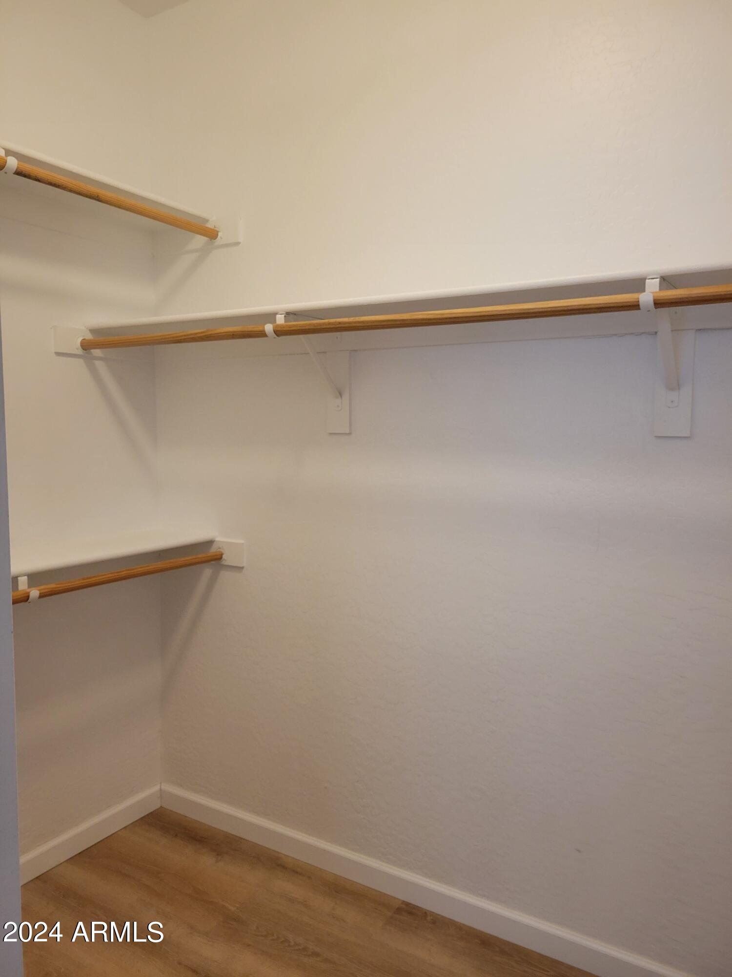 2300 East Magma Road, Unit 170 San Tan Valley, AZ 85143 - Photo 16 of 22 a view of a room with racks on the wall