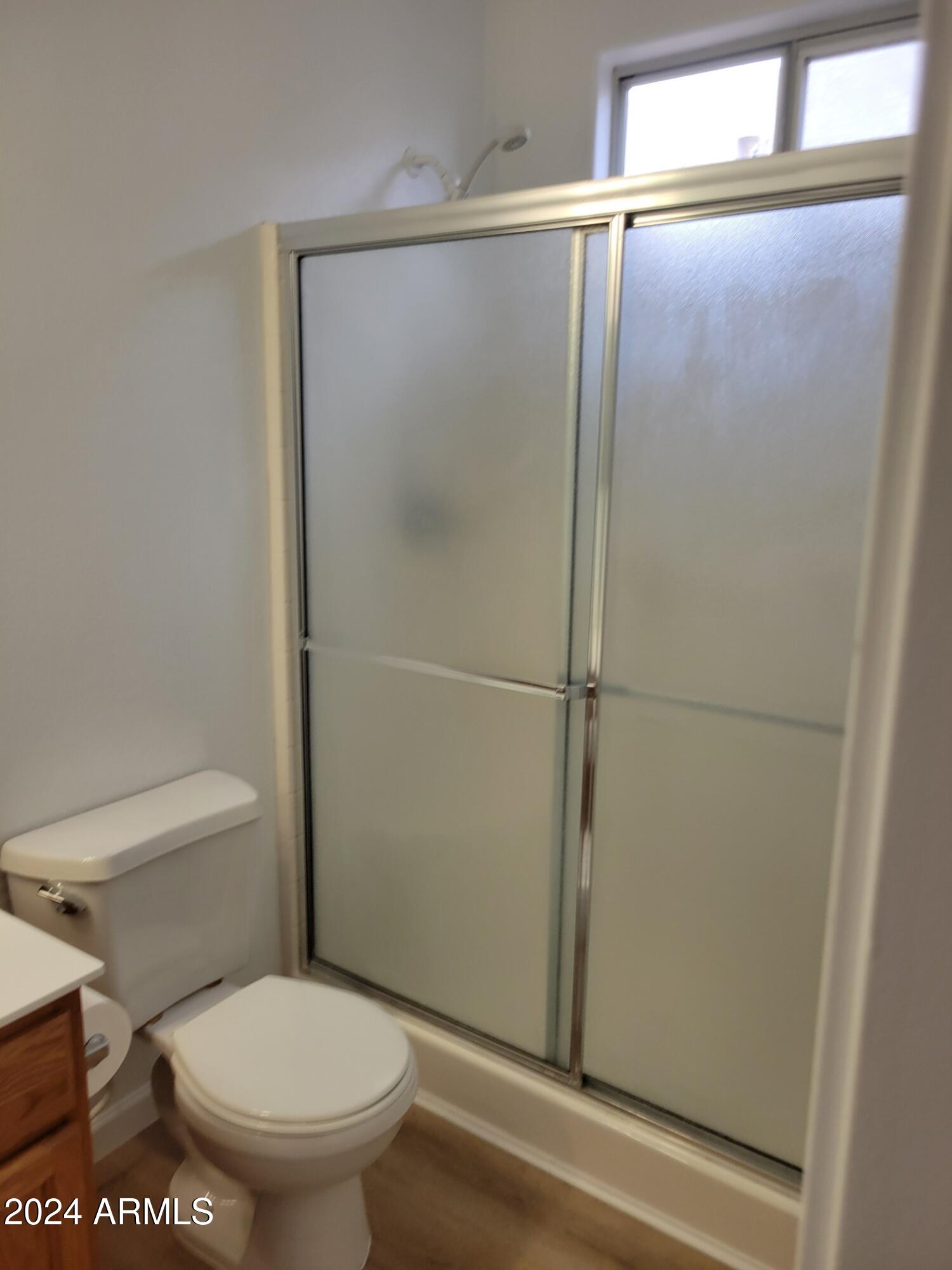 2300 East Magma Road, Unit 170 San Tan Valley, AZ 85143 - Photo 17 of 22 a bathroom with a toilet and a shower