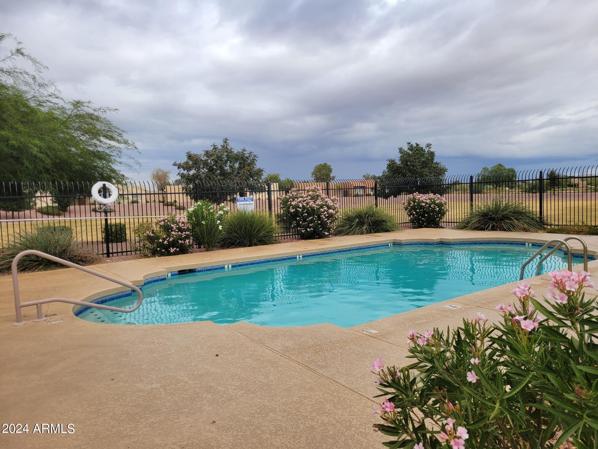 2300 East Magma Road, Unit 170 San Tan Valley, AZ 85143 - Photo 21 of 22 a view of a lake with a yard