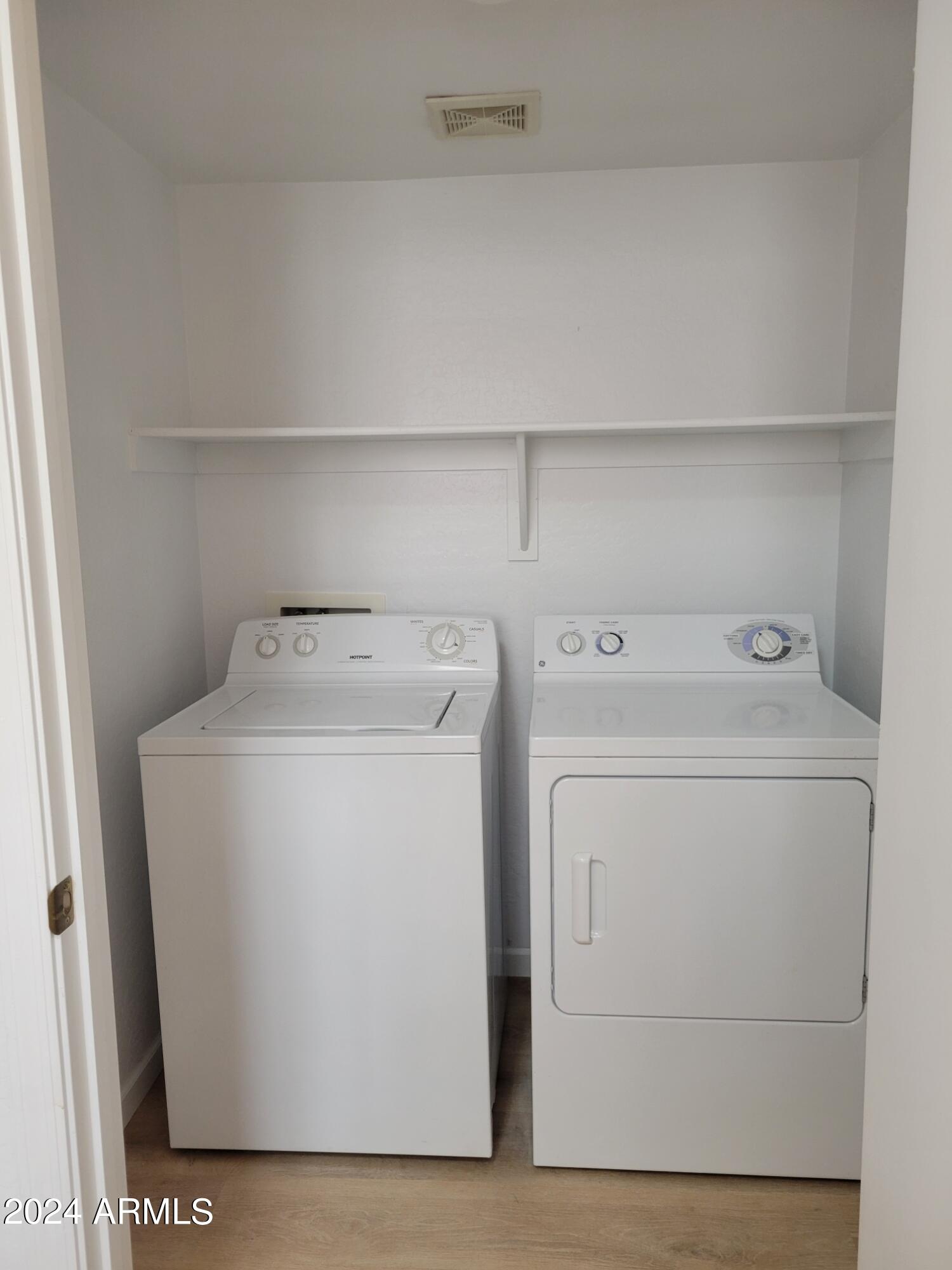 2300 East Magma Road, Unit 170 San Tan Valley, AZ 85143 - Photo 9 of 22 a utility room with dryer and washer