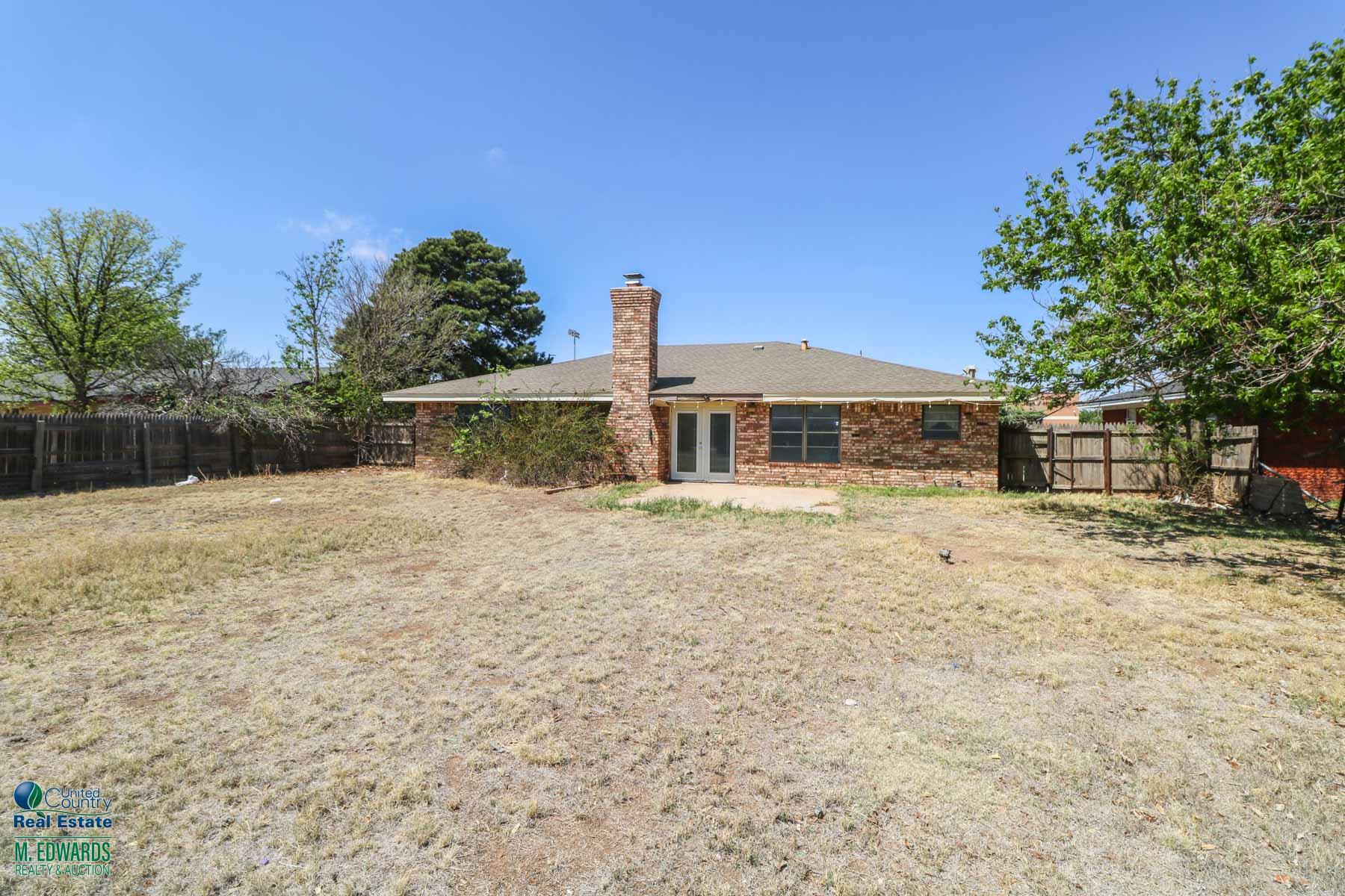 705 West Virginia Street Floydada, TX 79235 - Photo 14 of 15 a front view of a house with a yard