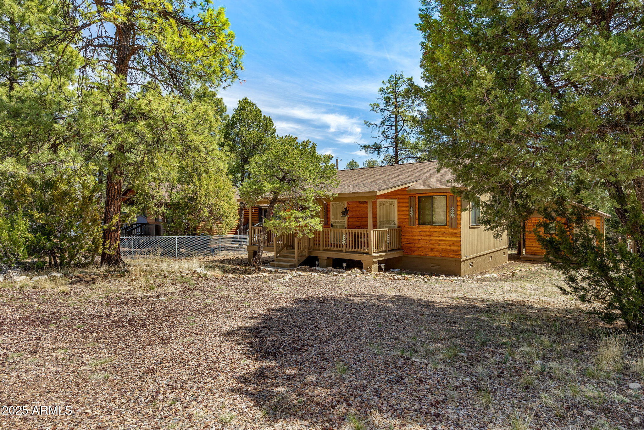 2979 Western Star Drive Overgaard, AZ 85933 - Photo 2 of 29 a view of a house with a tree in the background