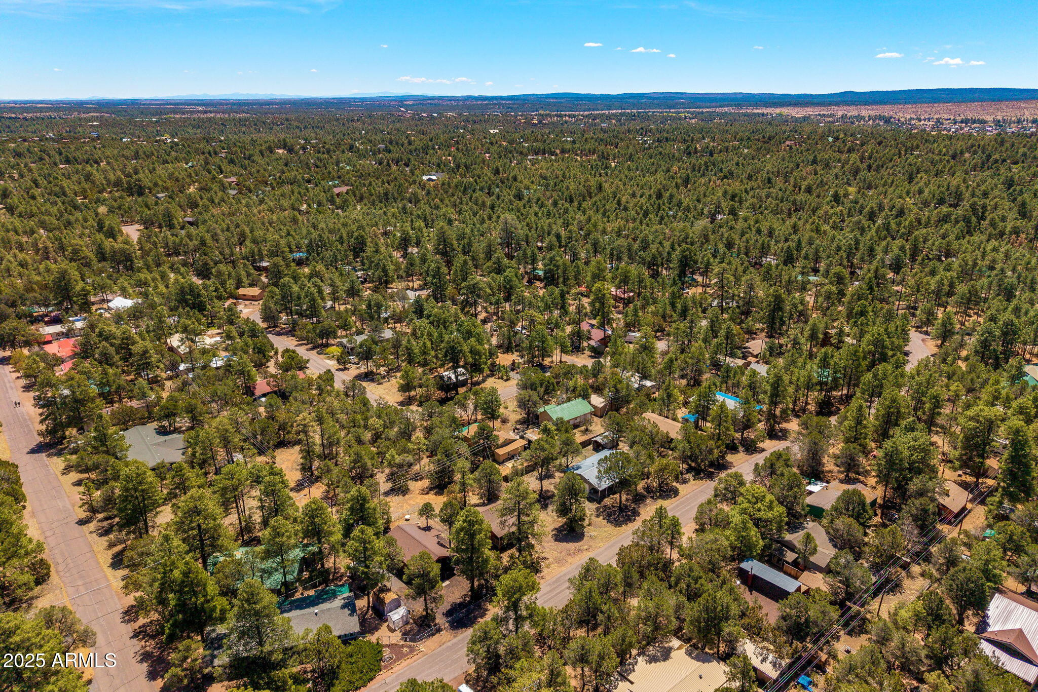 2979 Western Star Drive Overgaard, AZ 85933 - Photo 26 of 29 an aerial view of residential houses with outdoor space