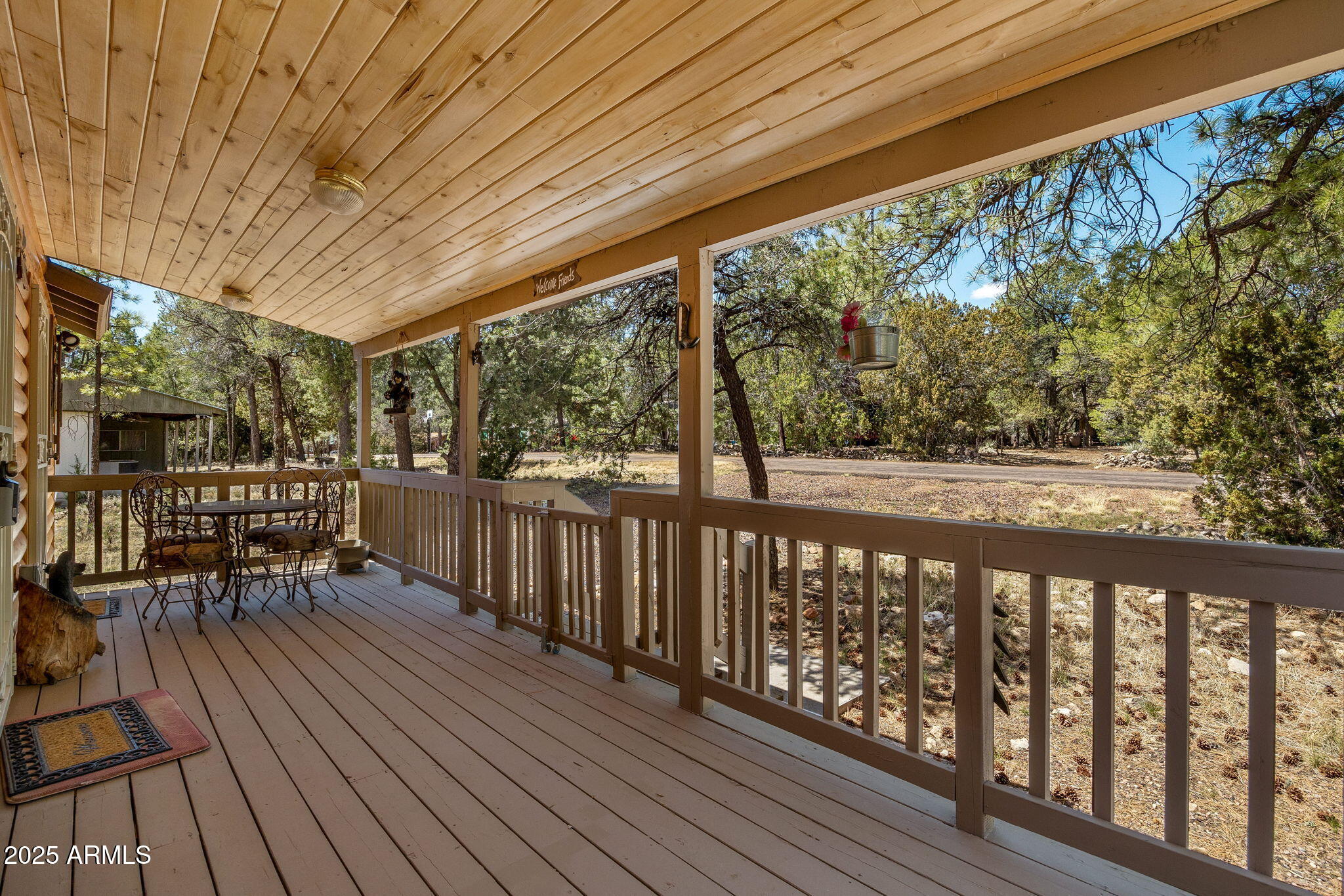 2979 Western Star Drive Overgaard, AZ 85933 - Photo 4 of 29 a balcony with wooden floor and outdoor space