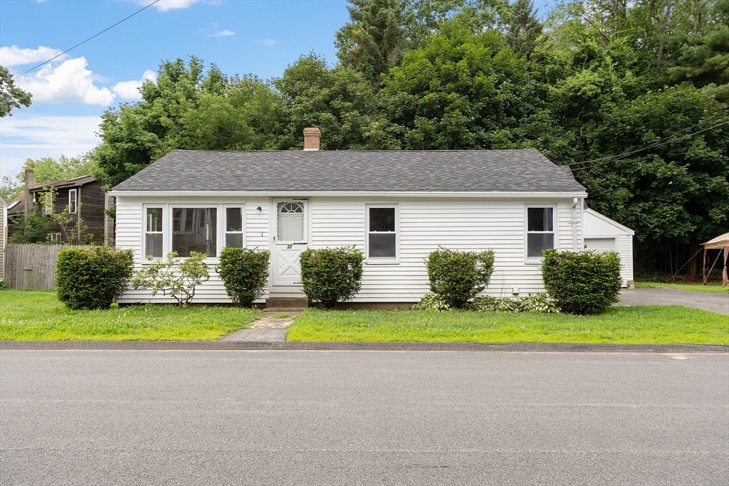 a house with swimming pool in front of it