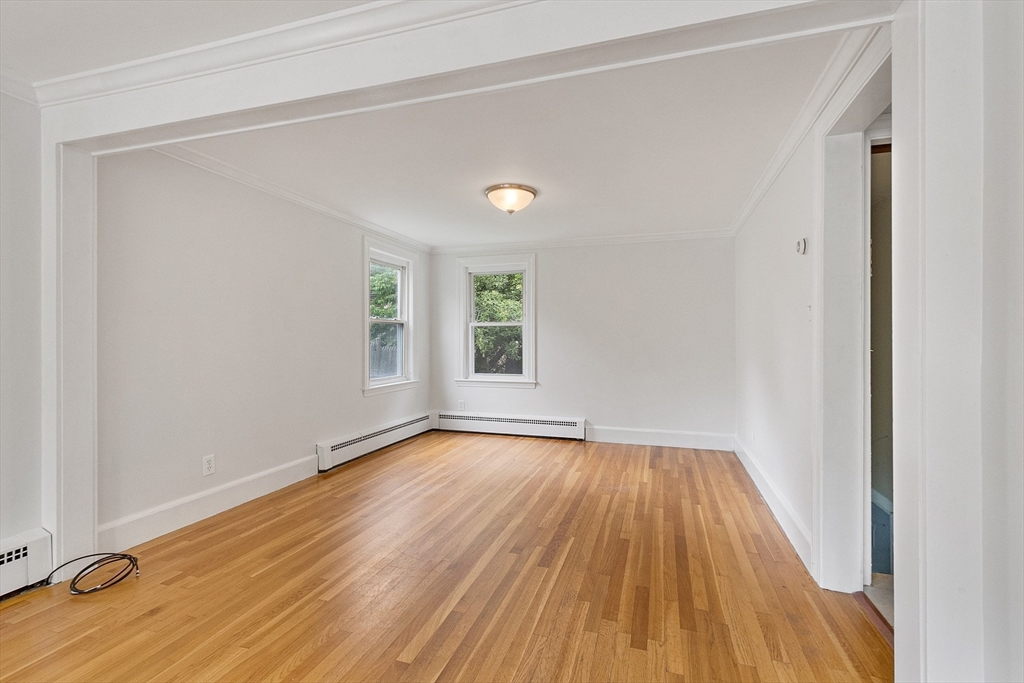 32 Pond Street Gardner, MA 01440 - Photo 17 of 34 a view of an empty room with wooden floor and a window