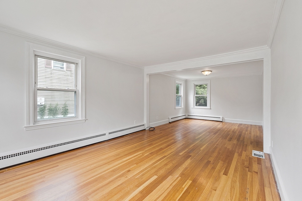32 Pond Street Gardner, MA 01440 - Photo 19 of 34 a view of an empty room with wooden floor and a window