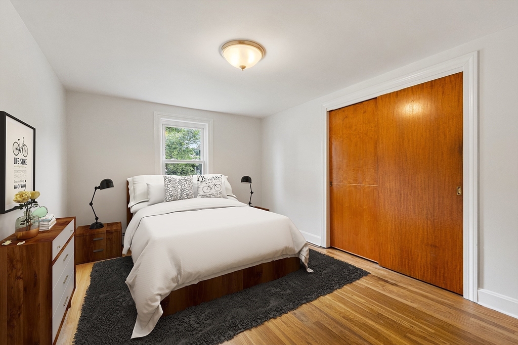32 Pond Street Gardner, MA 01440 - Photo 23 of 34 a bedroom with a bed and a dresser