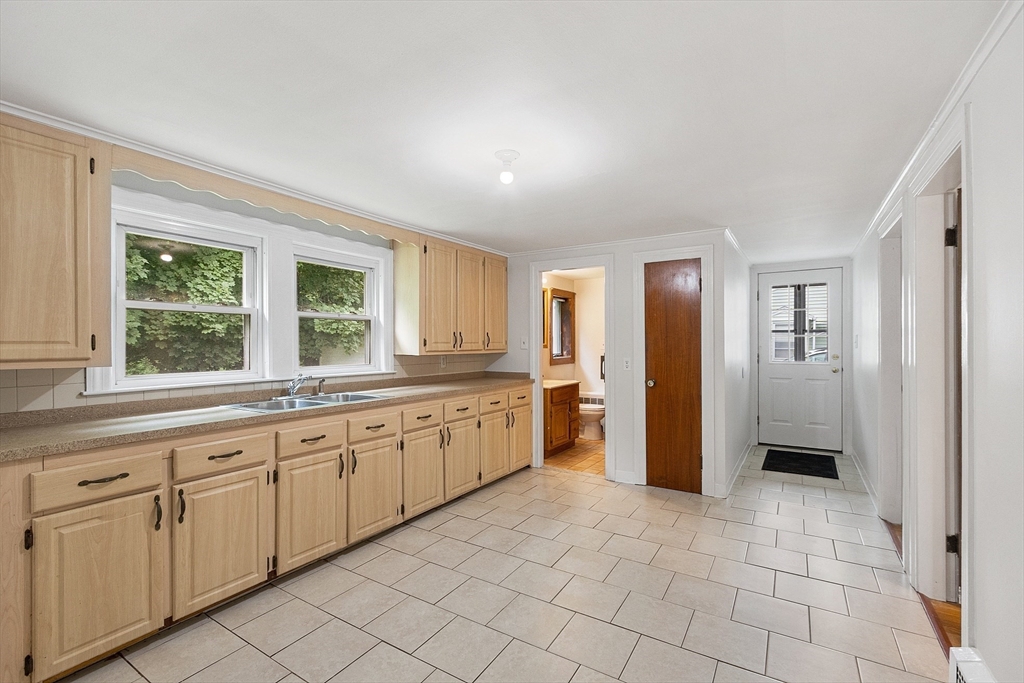 32 Pond Street Gardner, MA 01440 - Photo 4 of 34 a large bathroom with a large mirror vanity and shower