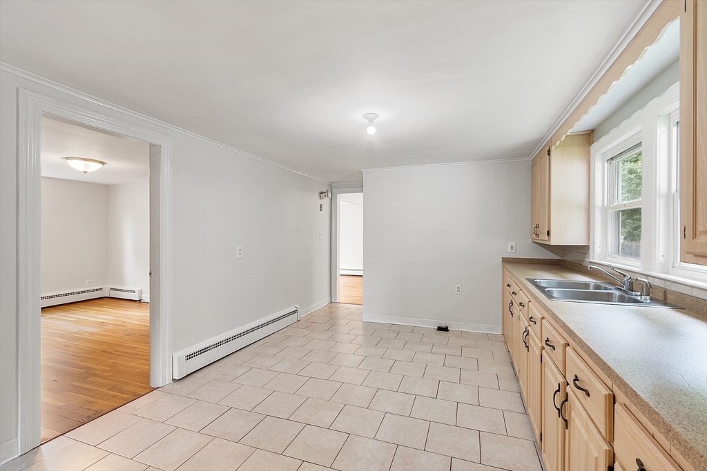 32 Pond Street Gardner, MA 01440 - Photo 7 of 34 a bathroom with a sink a mirror and a shower