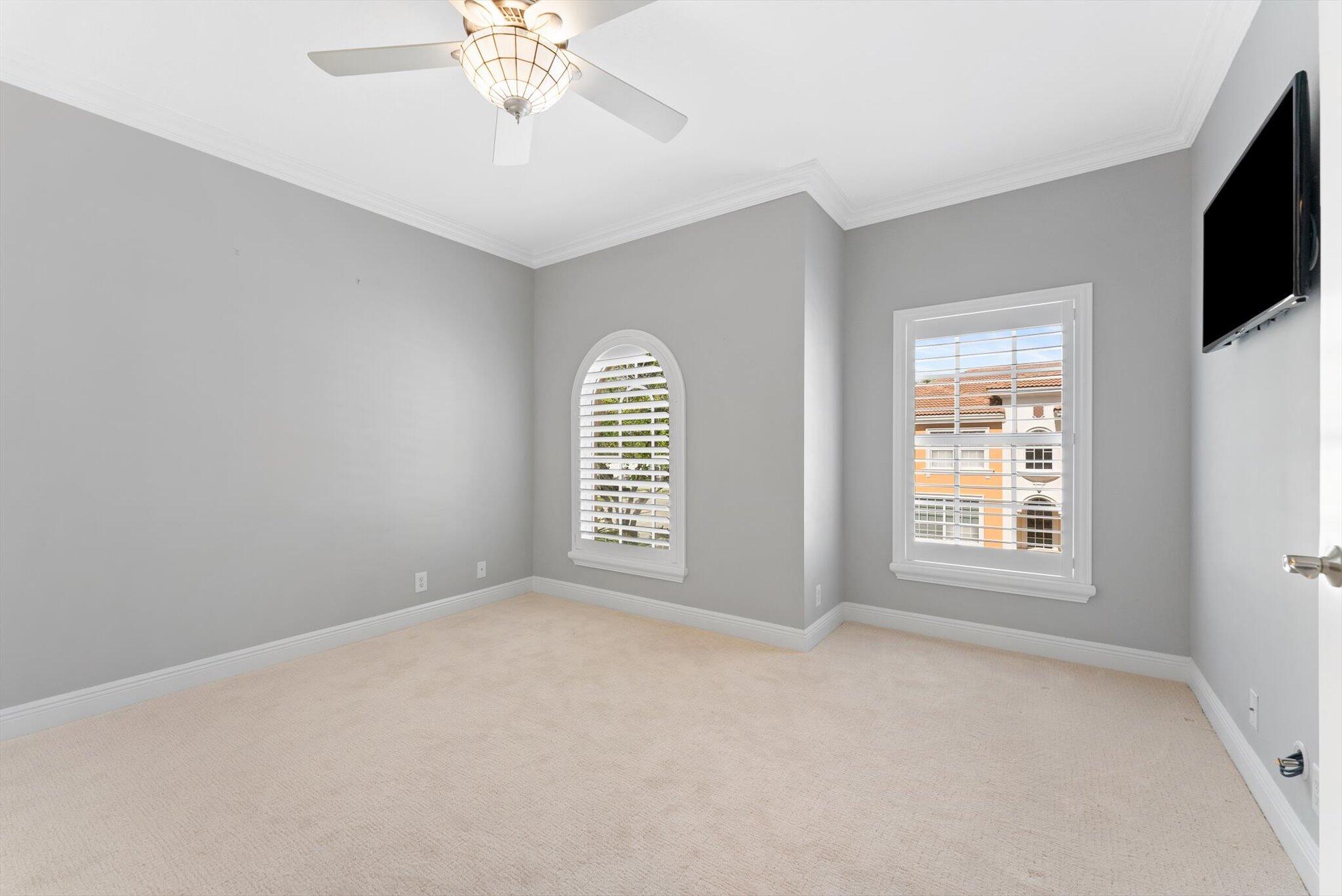 604 Northeast Francesca Lane Boca Raton, FL 33487 - Photo 23 of 55 an empty room with windows and fireplace