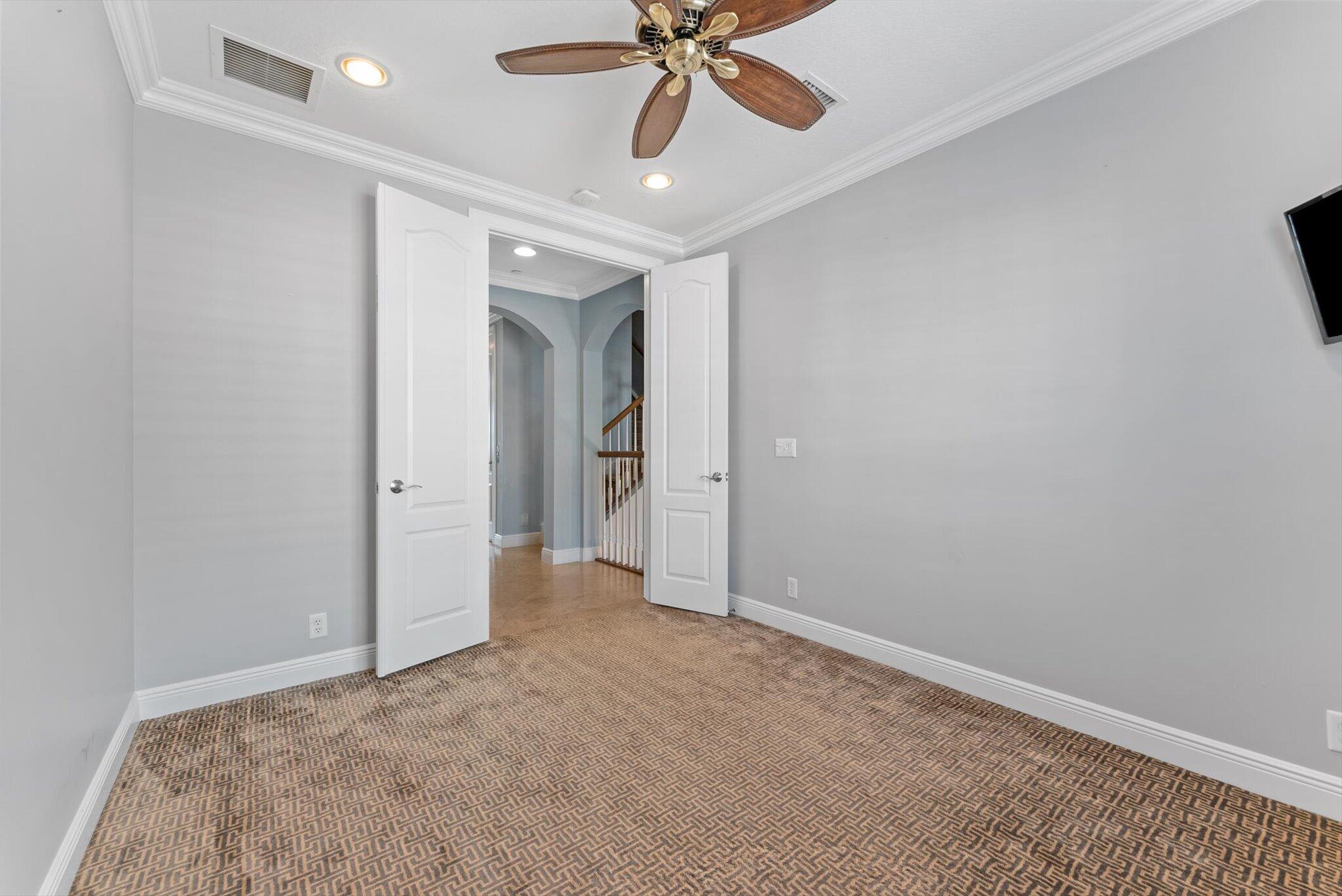 604 Northeast Francesca Lane Boca Raton, FL 33487 - Photo 31 of 55 a view of an empty room and chandelier fan