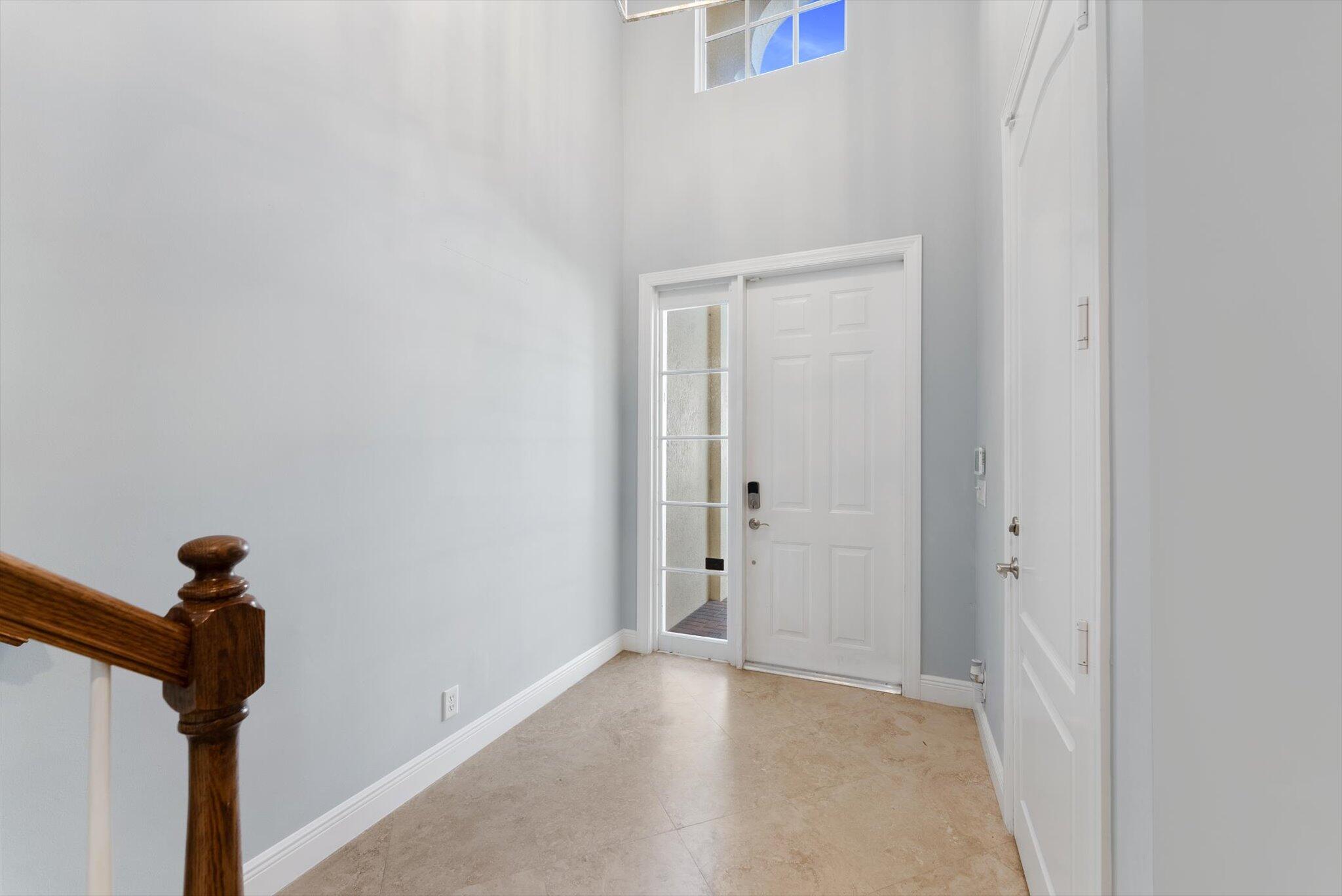 604 Northeast Francesca Lane Boca Raton, FL 33487 - Photo 4 of 55 a view of a hallway with a closet
