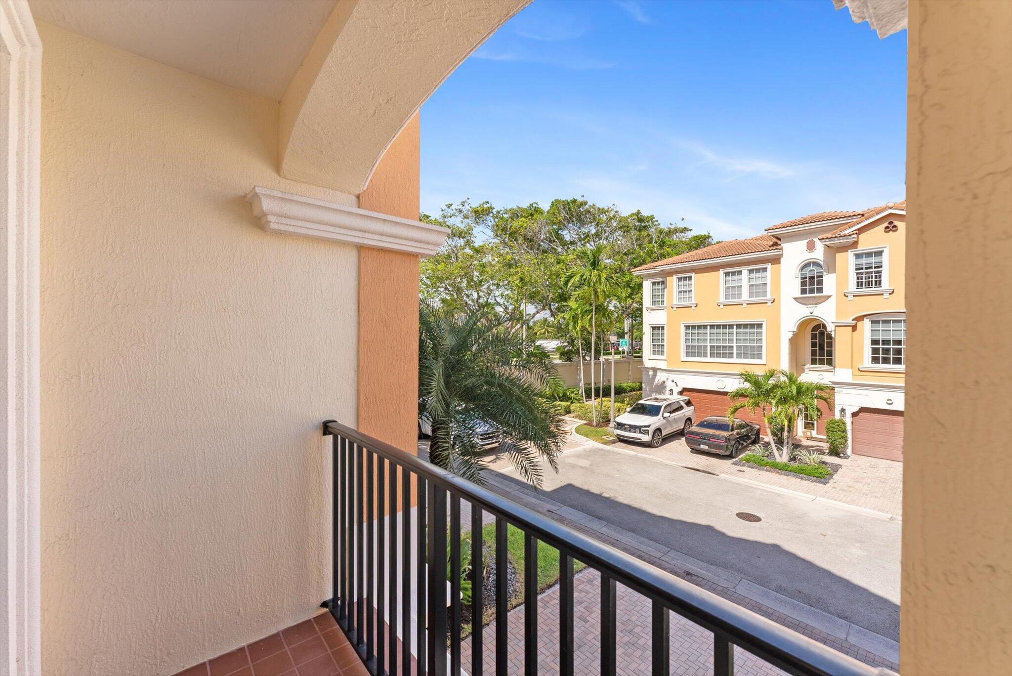 604 Northeast Francesca Lane Boca Raton, FL 33487 - Photo 43 of 55 a view of a balcony with chairs and a potted plant