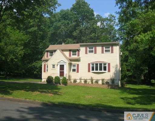34 Stiles Road Warren, NJ 07059 - Photo 1 of 4 a front view of a house with a garden