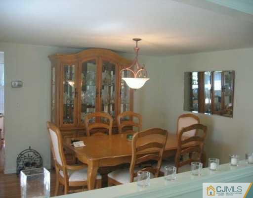 34 Stiles Road Warren, NJ 07059 - Photo 2 of 4 a view of a dining room with furniture and chandelier