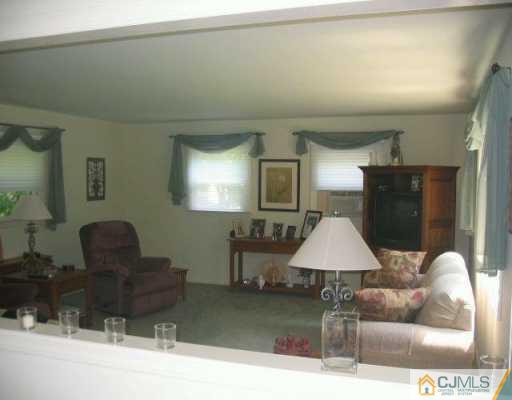 34 Stiles Road Warren, NJ 07059 - Photo 3 of 4 a lamp on a table in a livingroom