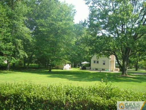 34 Stiles Road Warren, NJ 07059 - Photo 4 of 4 a view of a trees with a big yard