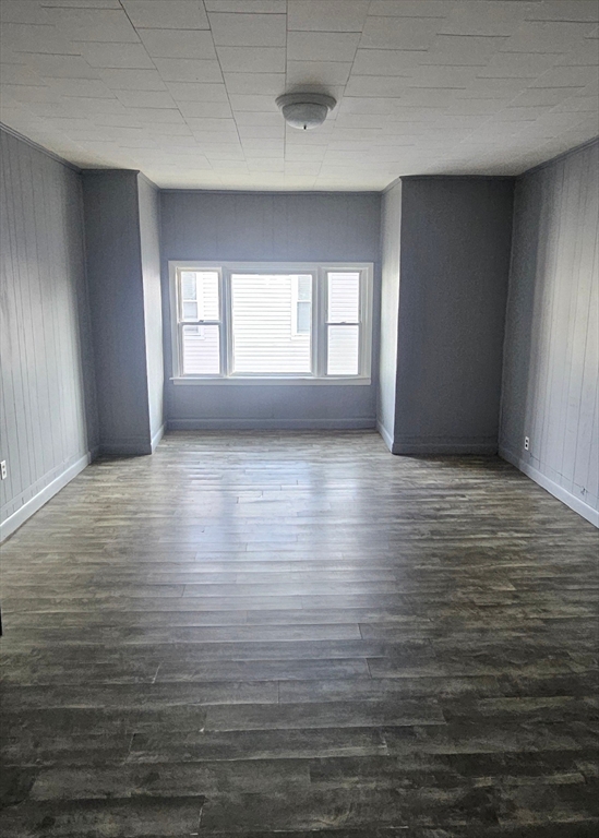 wooden floor in an empty room with window
