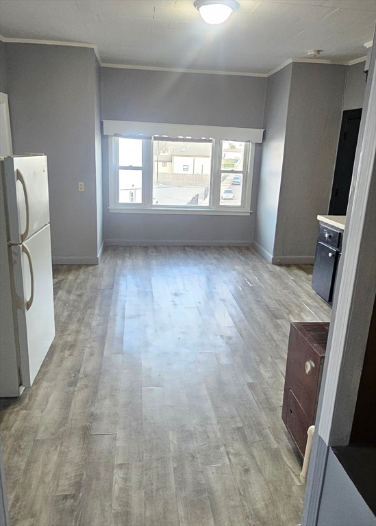 111 Covel Street, Unit 3 Fall River, MA 02723 - Photo 2 of 11 a view of an empty room with a window
