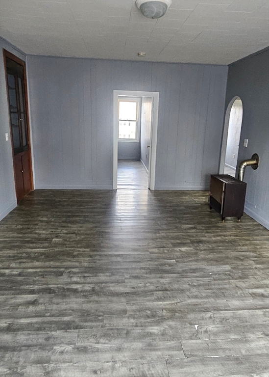 111 Covel Street, Unit 3 Fall River, MA 02723 - Photo 3 of 11 a view of empty room with window and fireplace
