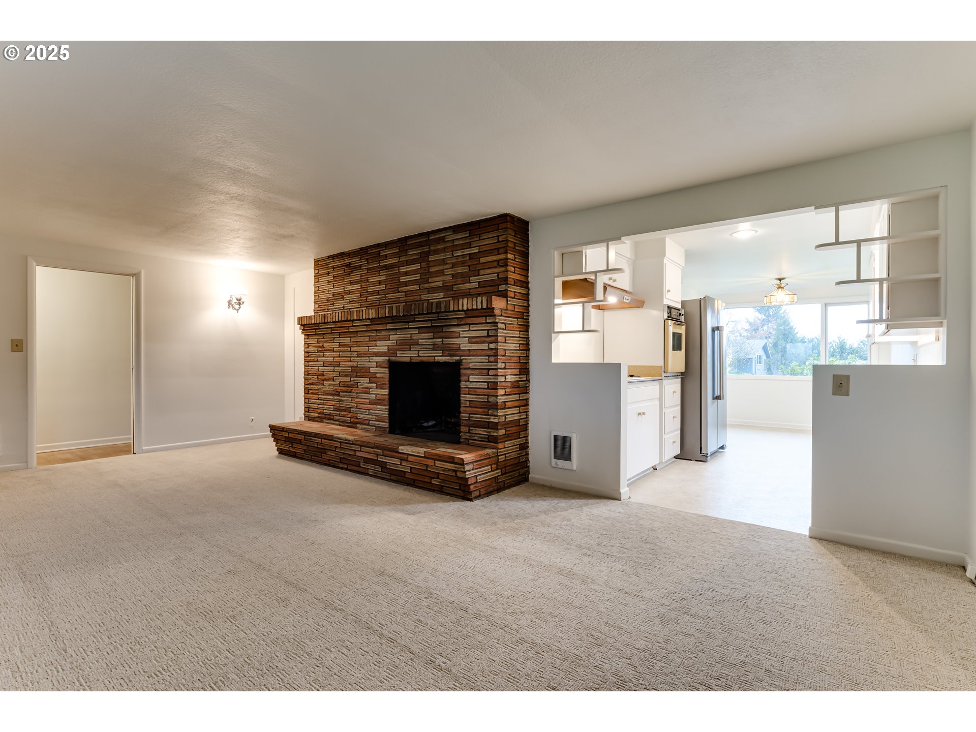 2550 Lawrence Street Eugene, OR 97405 - Photo 18 of 48 a view of empty room with a fireplace