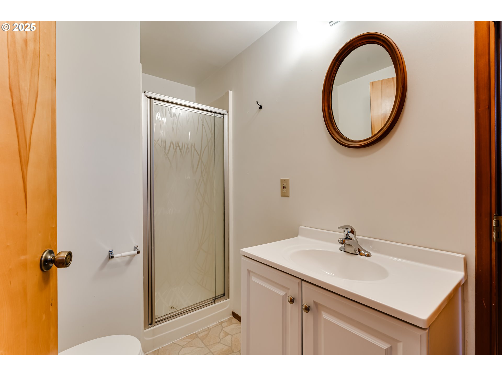 2550 Lawrence Street Eugene, OR 97405 - Photo 34 of 48 a bathroom with a sink a mirror and a shower