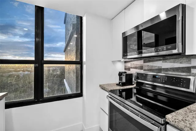 a kitchen with a stove and a microwave