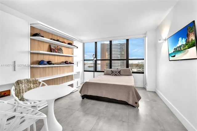 a living room with a bed furniture and decor