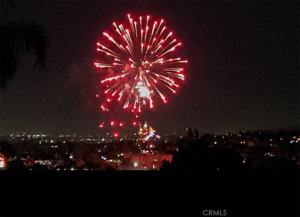 311 Montechico Drive Monterey Park, CA 91754 - Photo 60 of 73 Annual Barnes Park fireworks display as seen from garage deck.