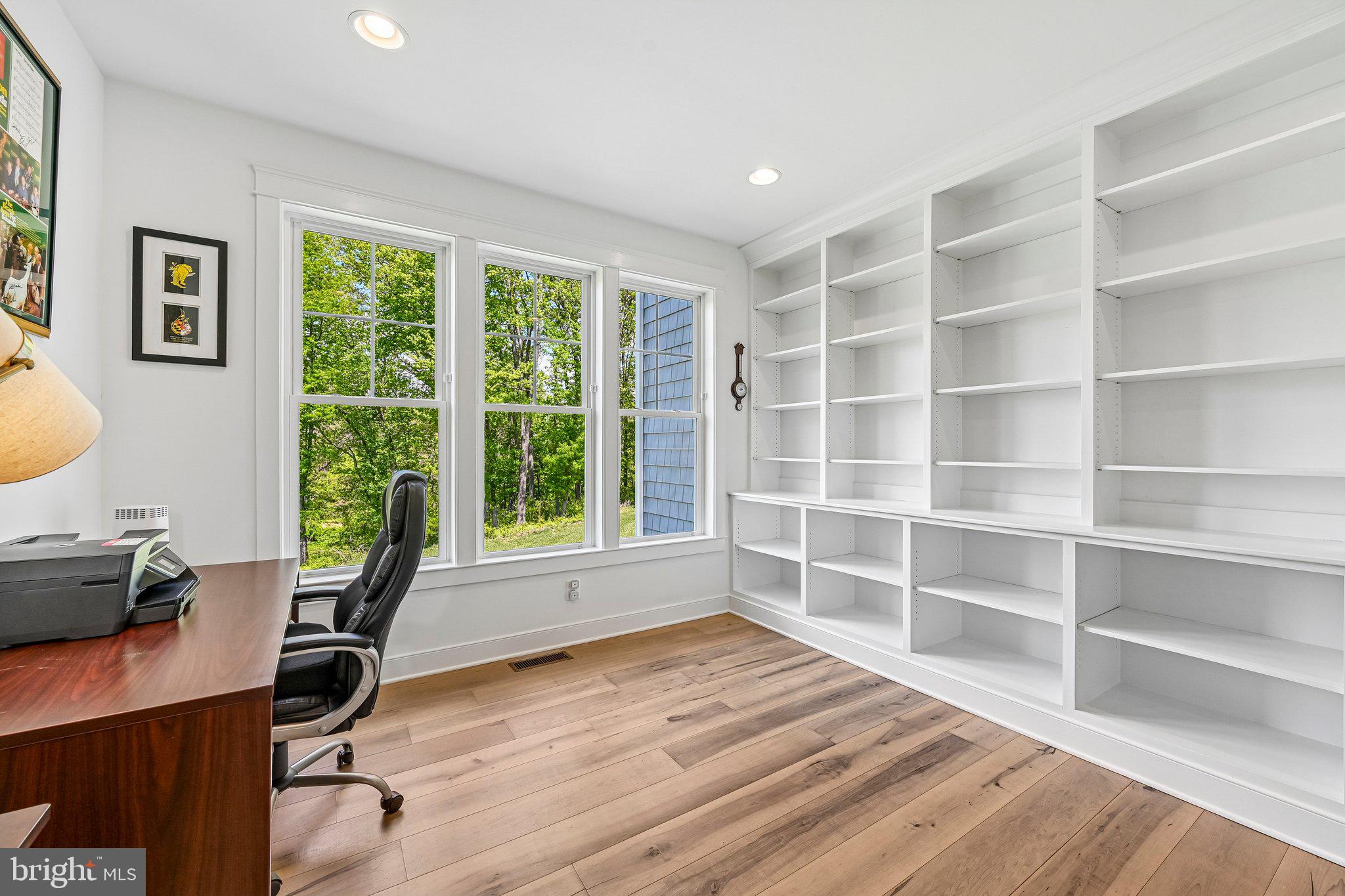 14516 Old Frederick Road Cooksville, MD 21723 - Photo 29 of 100 a view of a workspace with furniture and a window