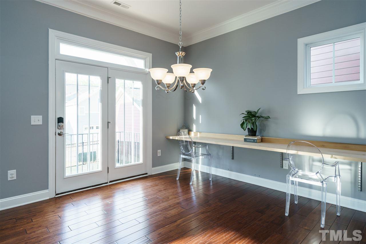 1334 Rodessa Run Raleigh, NC 27607 - Photo 10 of 25 a view of a room with wooden floor and chandelier