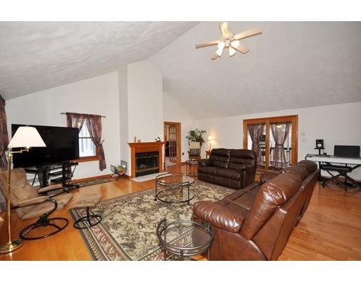 79 R Dalton Road Chelmsford, MA 01824 - Photo 8 of 38 a living room with furniture a fireplace and a flat screen tv